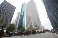 Driving in the parade through the skyscrapers downtown