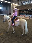 Daphne riding CH Princess Diana at 2015 Congress where she won 1st place trophy in her kids' riding class